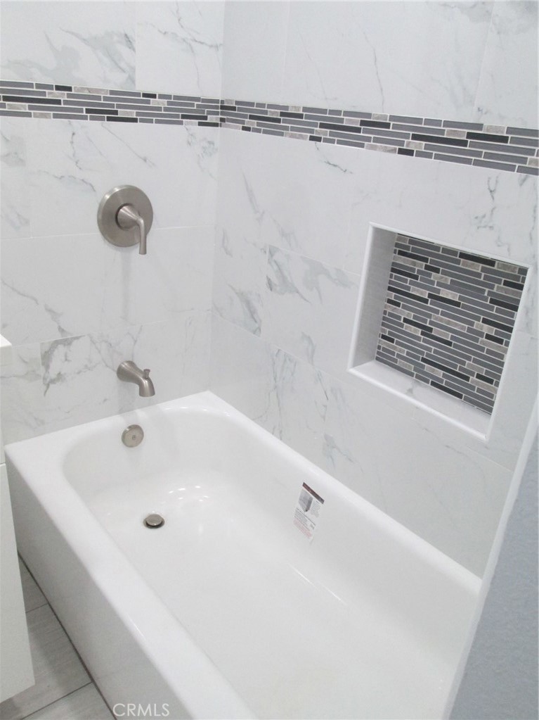 44552 Arabia Street Indio, CA 92201 - Photo 47 of 49 a bathroom with a bathtub and shower