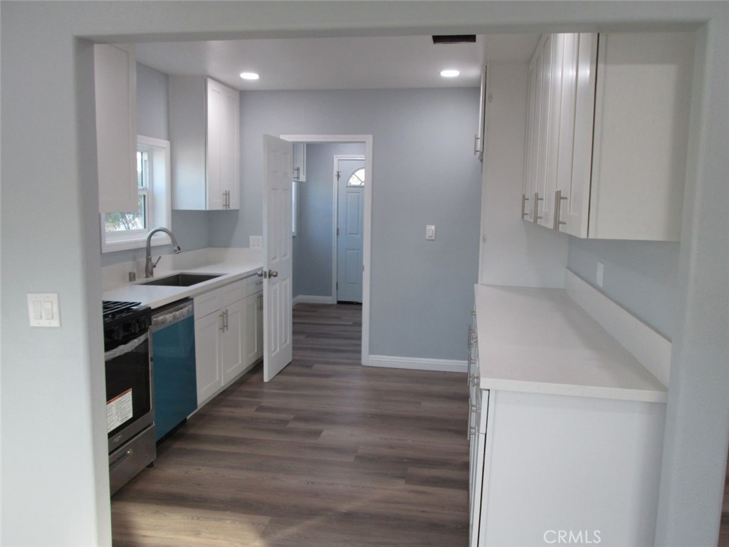 44552 Arabia Street Indio, CA 92201 - Photo 5 of 49 a large kitchen with stainless steel appliances granite countertop a sink and a refrigerator