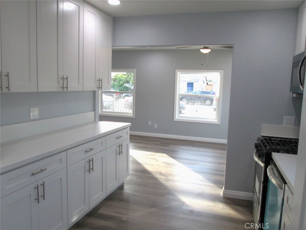44552 Arabia Street Indio, CA 92201 - Photo 8 of 49 a kitchen with granite countertop white cabinets and window