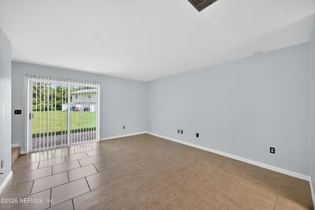 a view of a room with sliding glass door