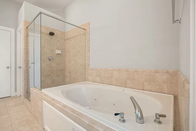 a bathroom with a tub and shower