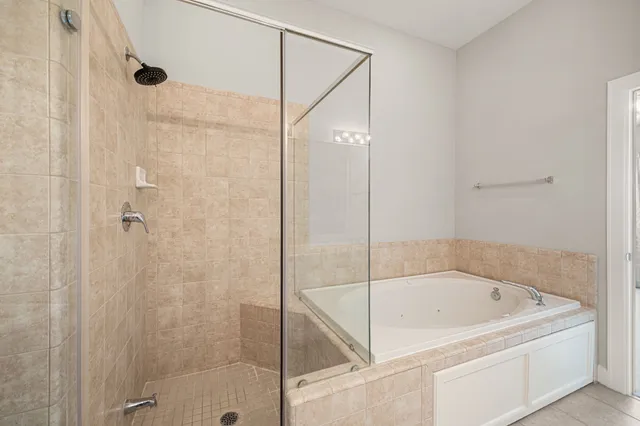 a bathroom with a bathtub and shower