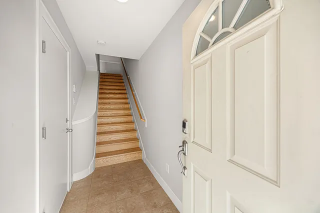 a view of a hallway with stairs