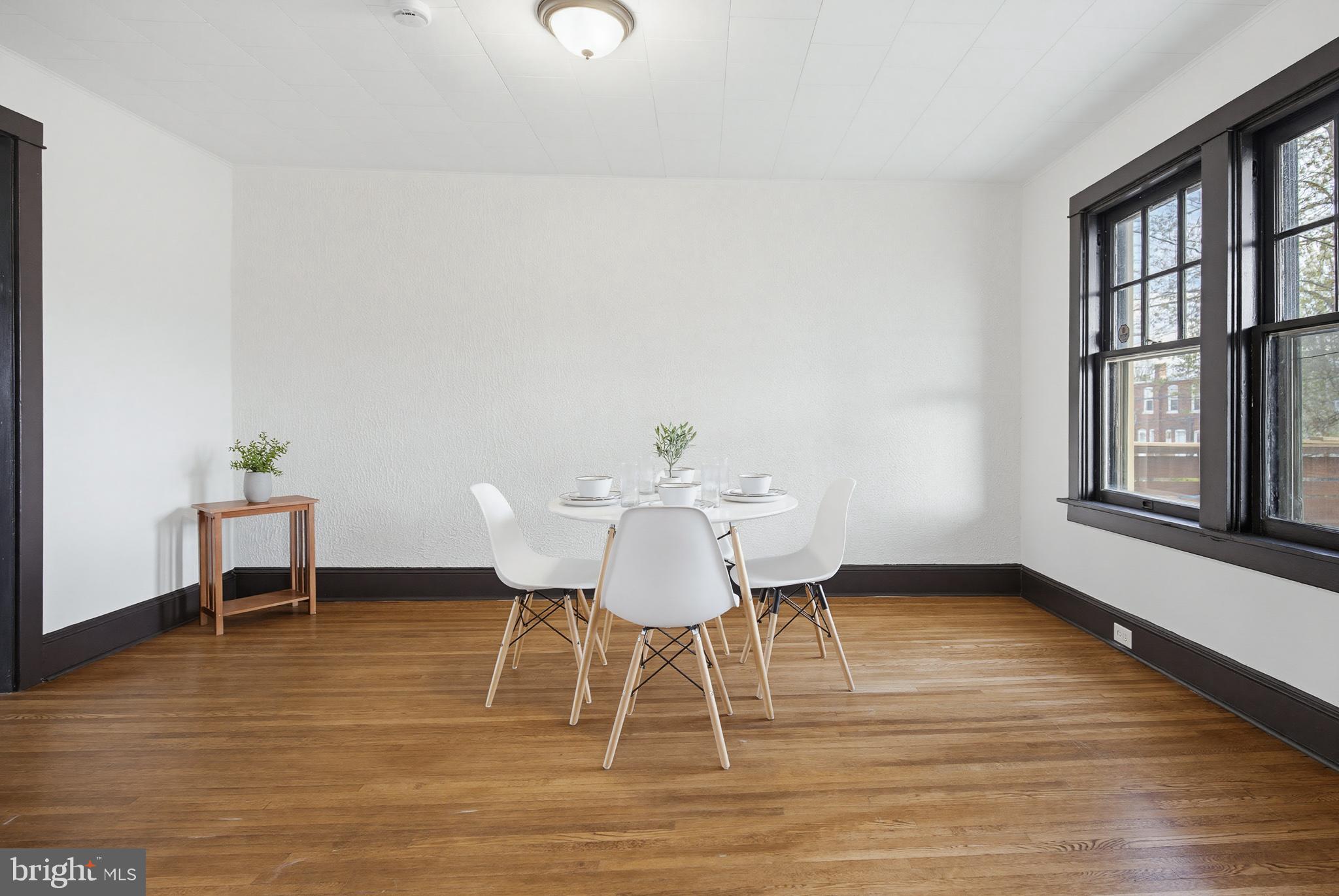 636 3rd Street Lancaster, PA 17603 - Photo 12 of 42 a view of a dining room with furniture window and wooden floor