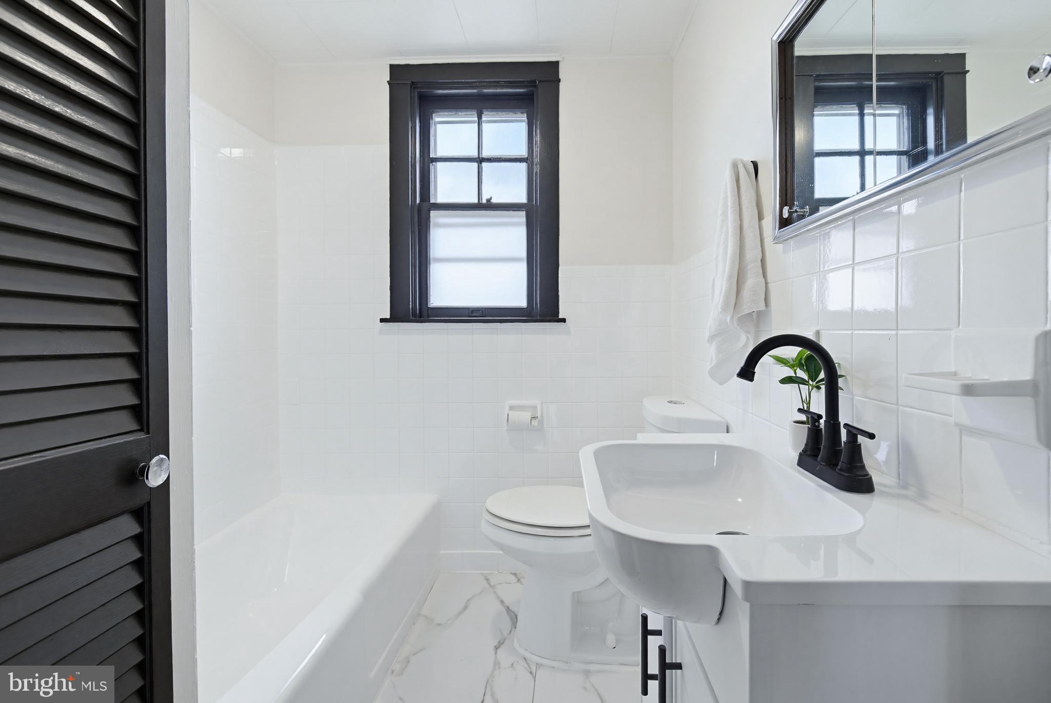 636 3rd Street Lancaster, PA 17603 - Photo 18 of 42 a bathroom with a sink and a toilet