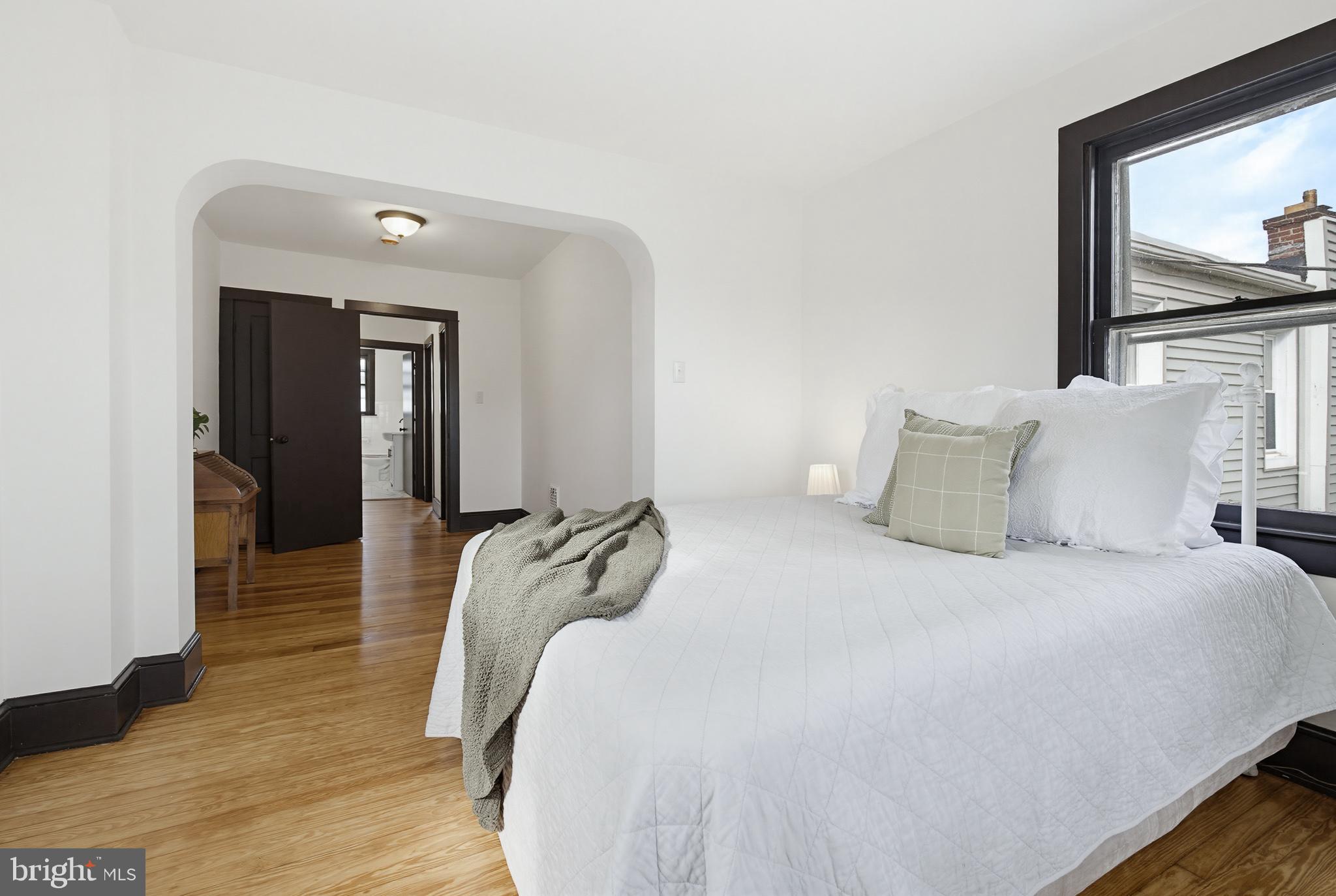 636 3rd Street Lancaster, PA 17603 - Photo 22 of 42 a bedroom with a bed and a painting on the wall