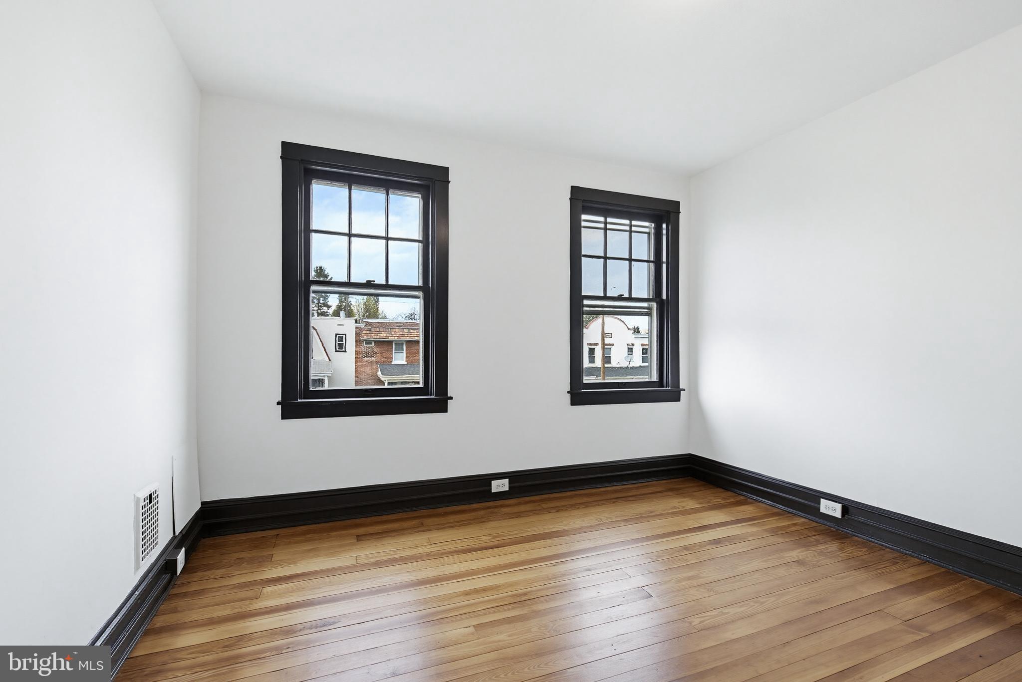 636 3rd Street Lancaster, PA 17603 - Photo 27 of 42 an empty room with wooden floor and windows