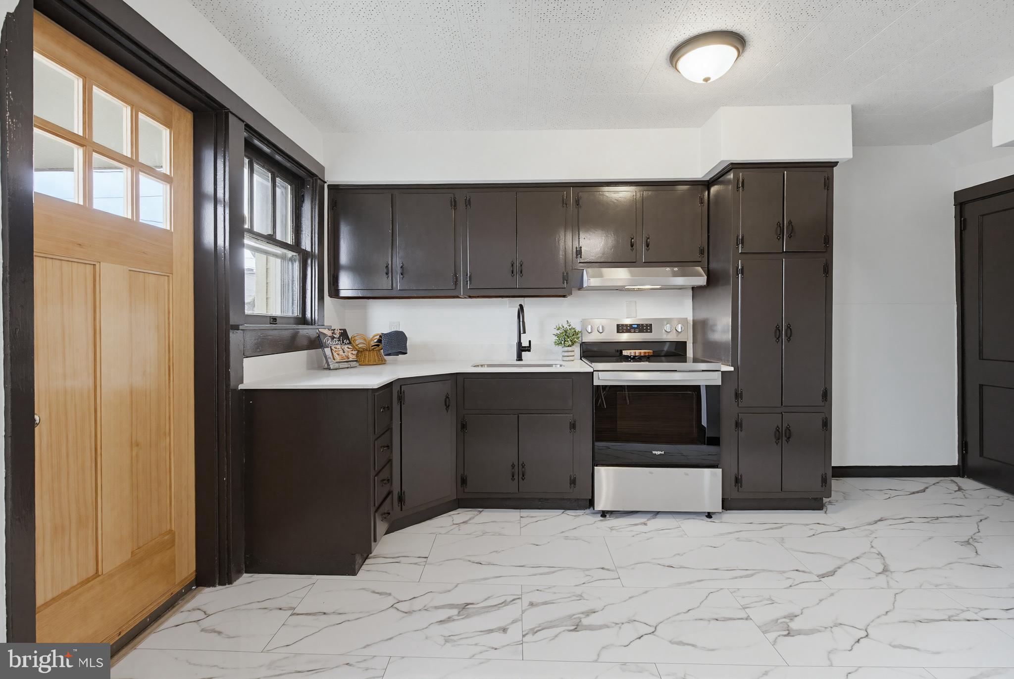 636 3rd Street Lancaster, PA 17603 - Photo 3 of 42 a kitchen with a refrigerator and a stove