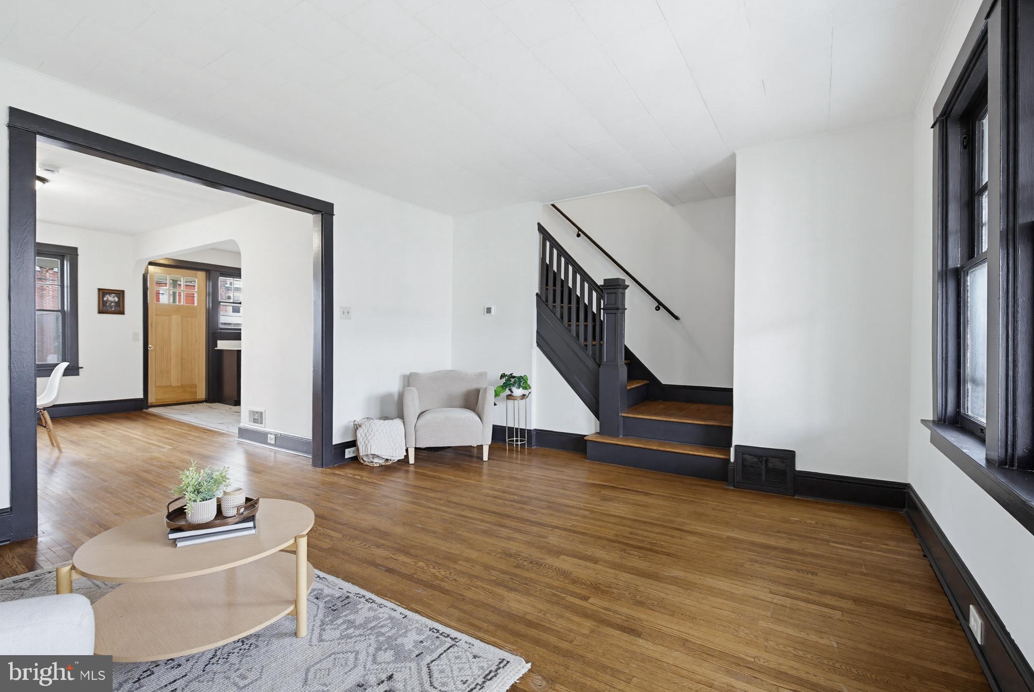 636 3rd Street Lancaster, PA 17603 - Photo 7 of 42 a living room with furniture and a wooden floor