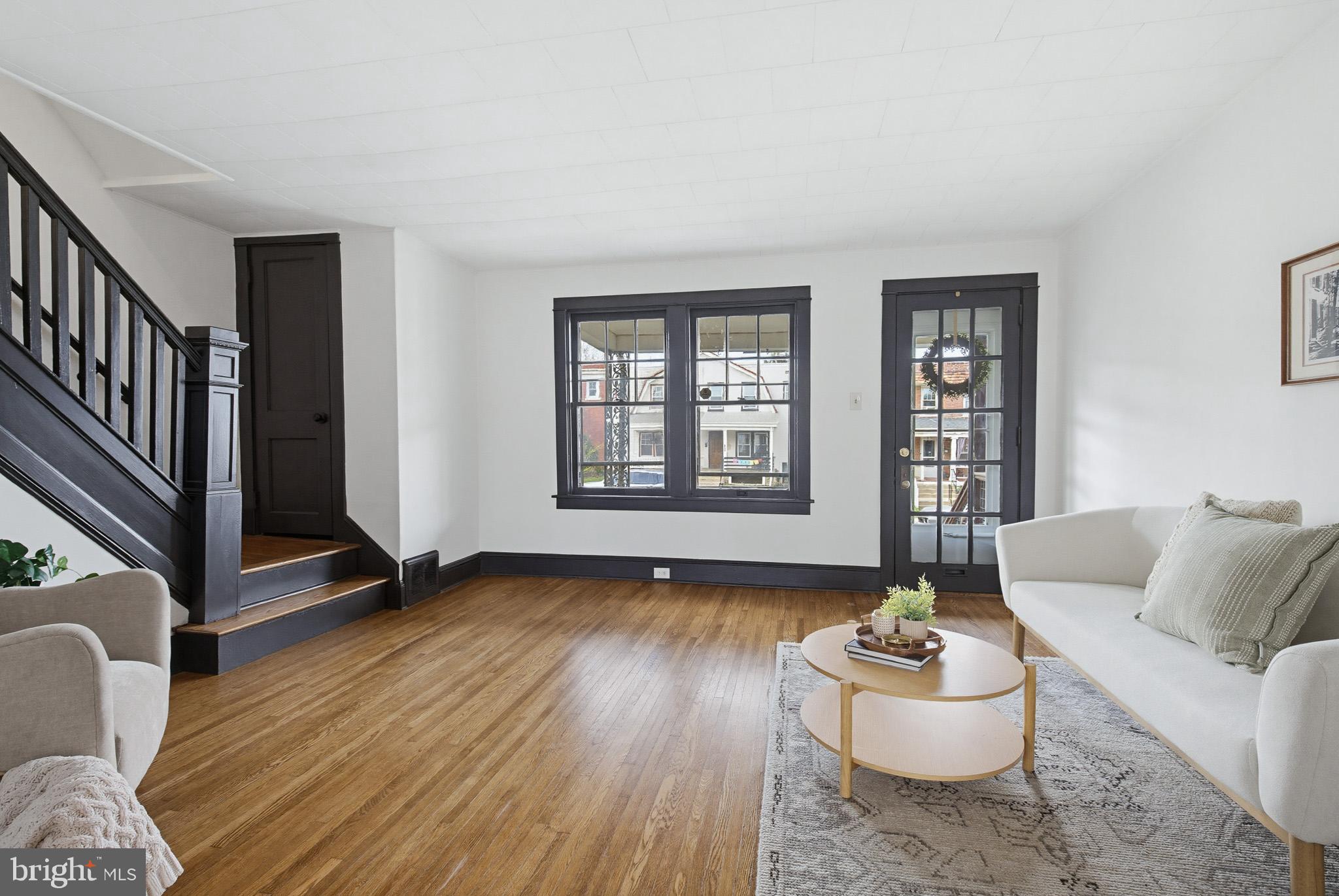 636 3rd Street Lancaster, PA 17603 - Photo 9 of 42 a living room with furniture and a wooden floor