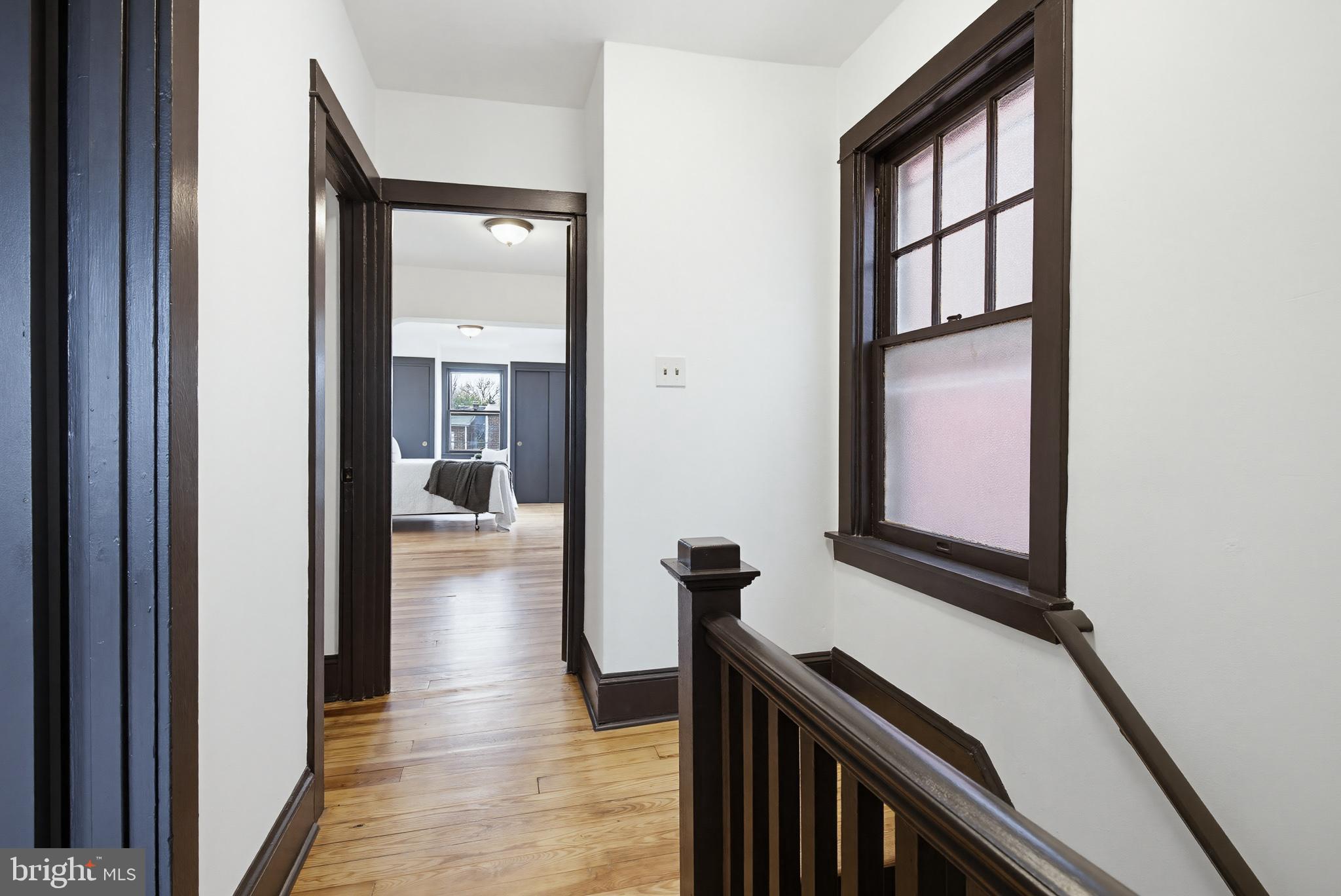 636 3rd Street Lancaster, PA 17603 - Photo 10 of 42 a view of a hallway with wooden floor and staircase