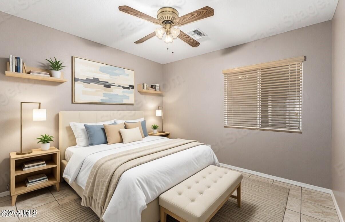 6356 West Avenida Del Rey Phoenix, AZ 85083 - Photo 10 of 31 a bedroom with a bed and a chandelier