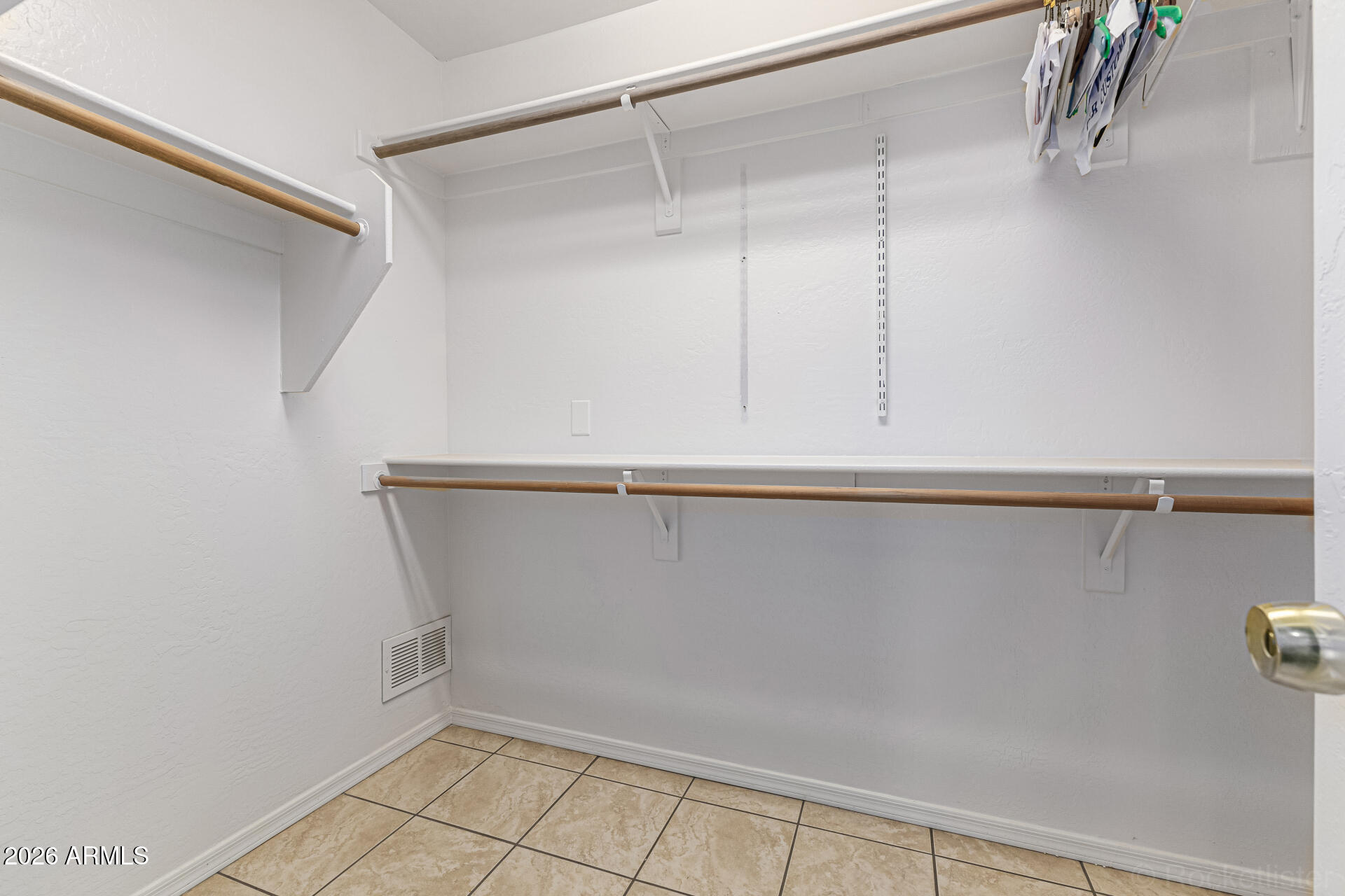 6356 West Avenida Del Rey Phoenix, AZ 85083 - Photo 14 of 31 a view of a room with racks on the wall