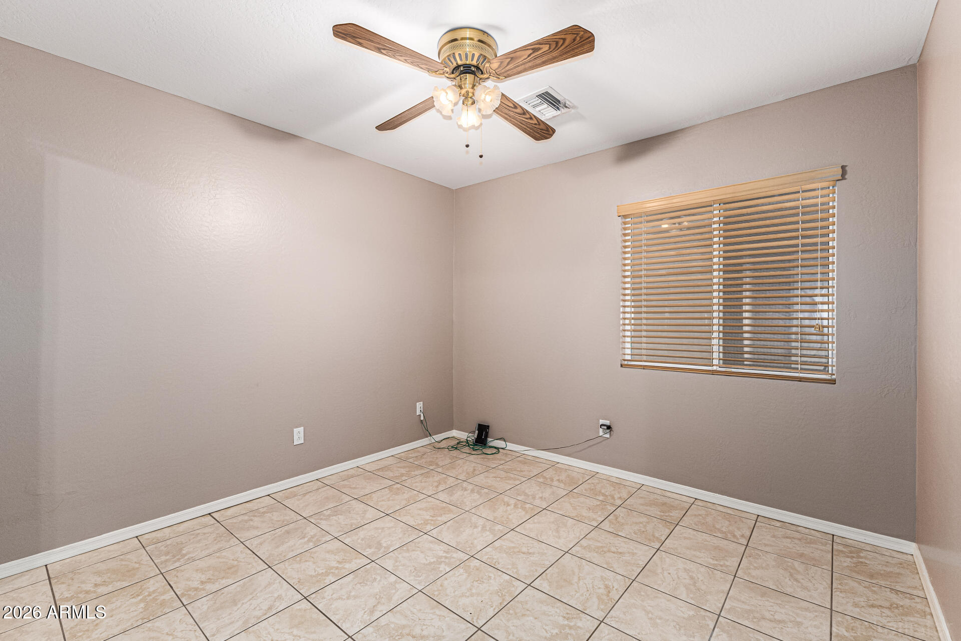 6356 West Avenida Del Rey Phoenix, AZ 85083 - Photo 17 of 31 a view of a room with a chandelier fan and windows