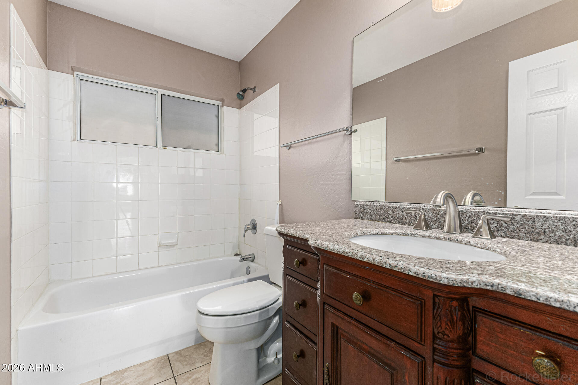 6356 West Avenida Del Rey Phoenix, AZ 85083 - Photo 19 of 31 a bathroom with a granite countertop sink toilet mirror and bathtub