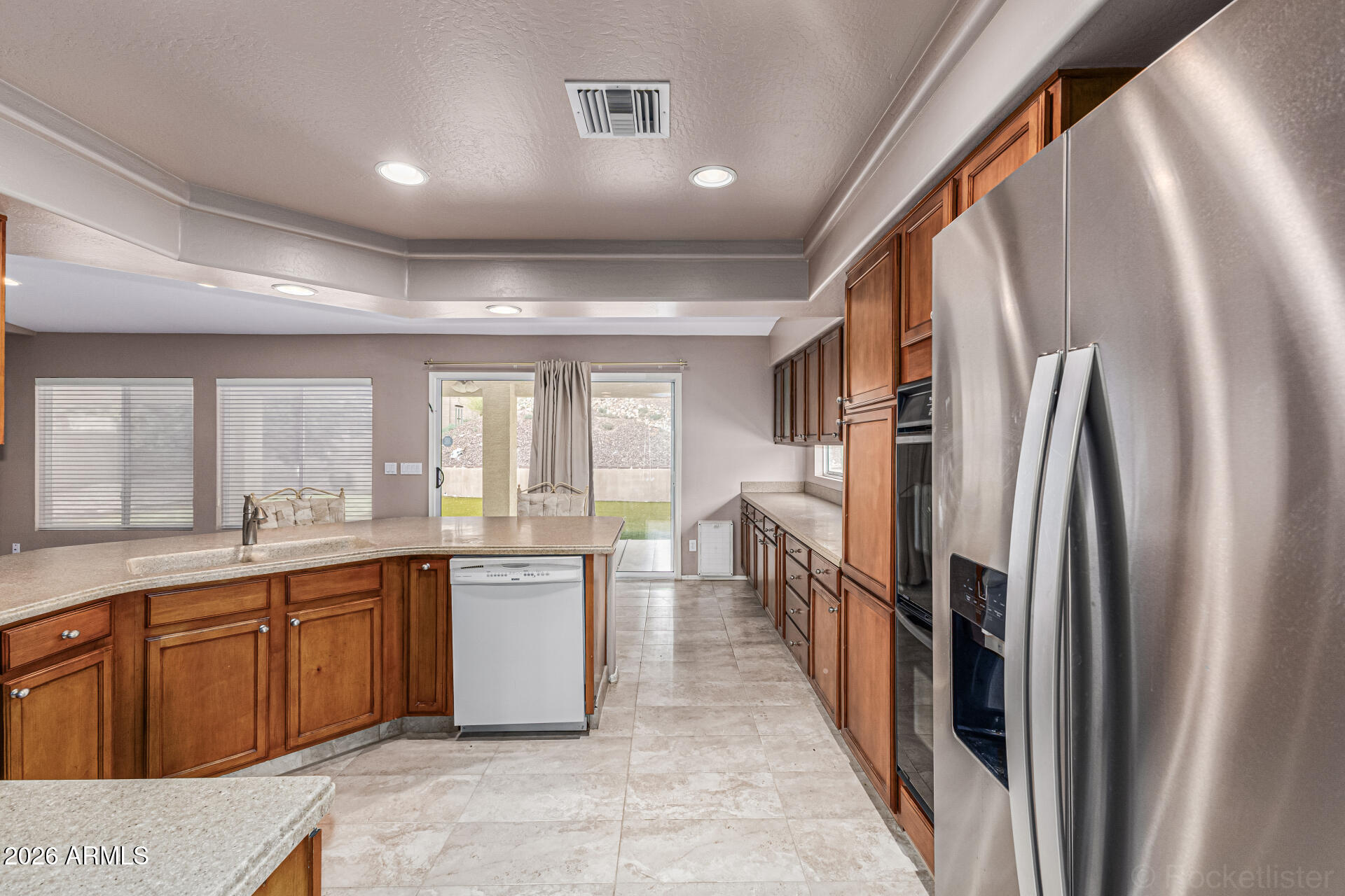 6356 West Avenida Del Rey Phoenix, AZ 85083 - Photo 6 of 31 a large kitchen with lot of cabinets and stainless steel appliances