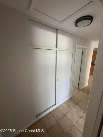a view of a livingroom with a sink and a mirror