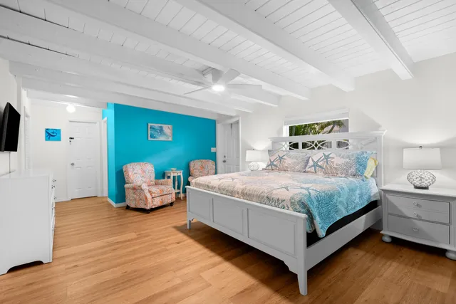 a bedroom with bed and a window