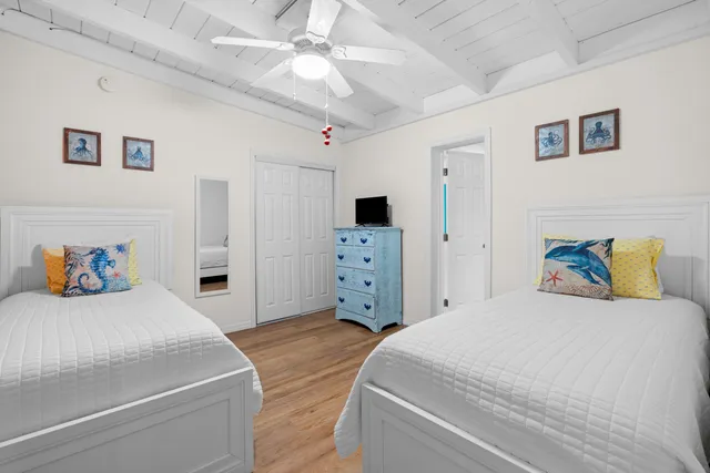 a bedroom with a bed and a view of kitchen