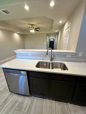 a kitchen with granite countertop a stove and a microwave