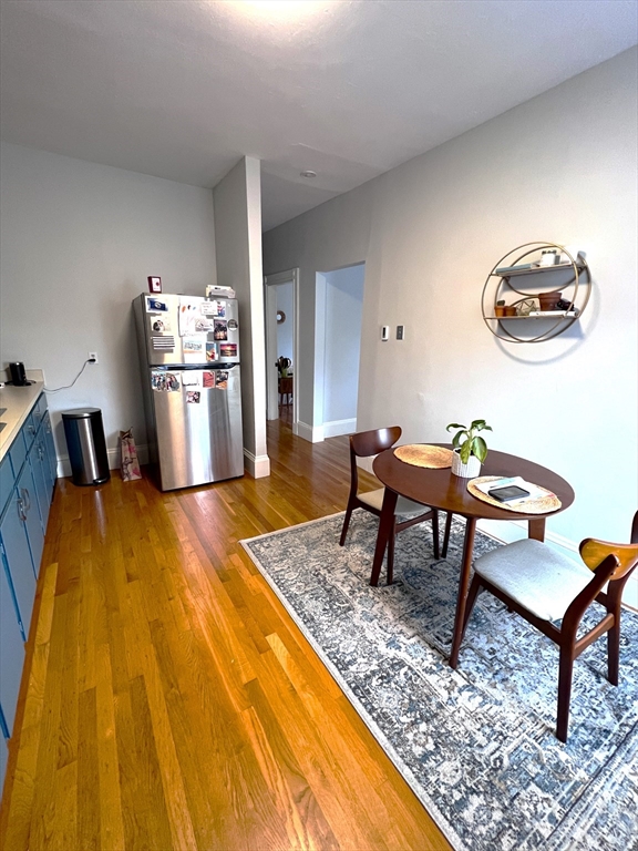 167 M Street, Unit 3F Boston, MA 02127 - Photo 3 of 7 a dining room with a table and chairs