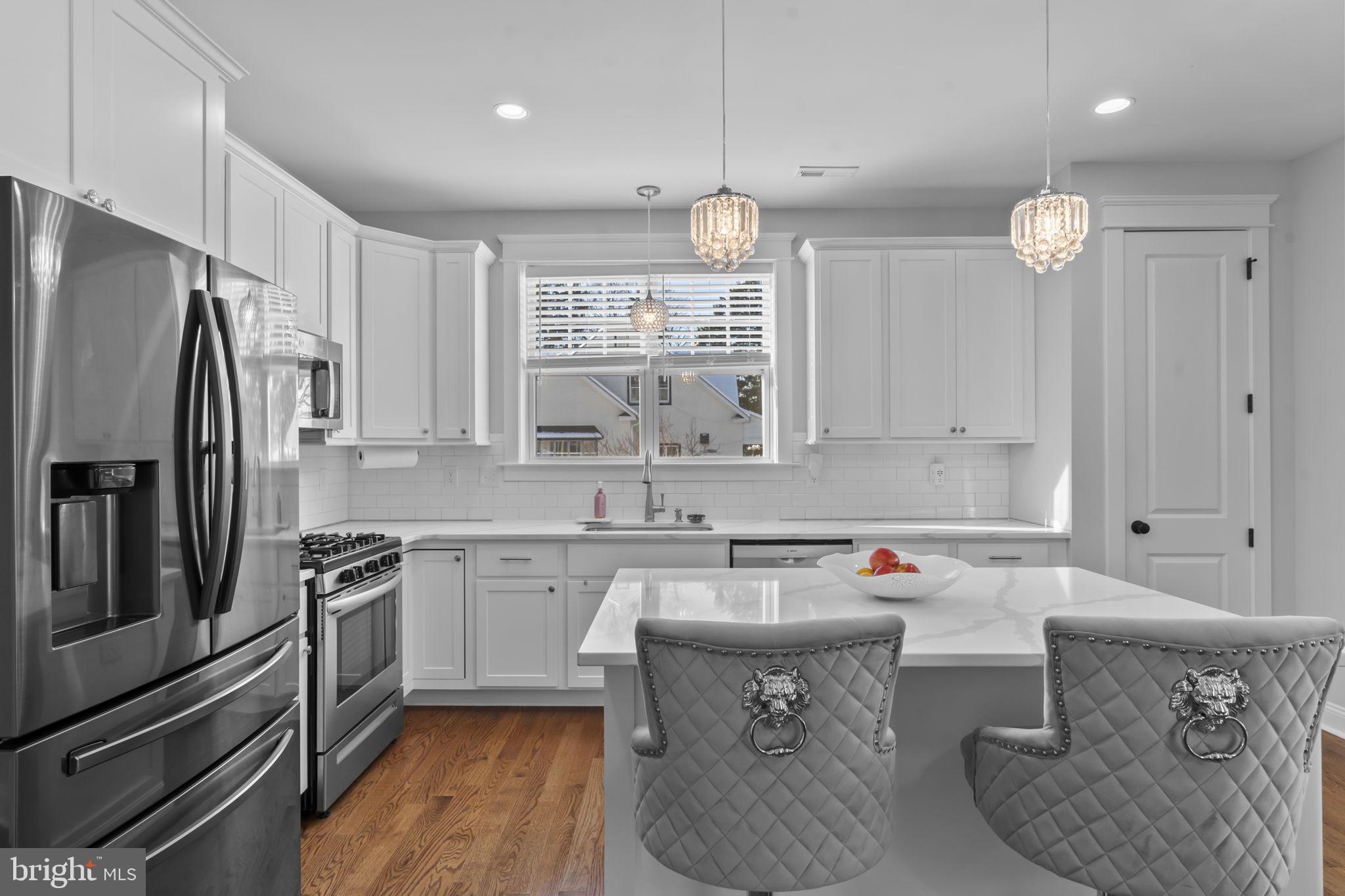 122 Church Road Jenkintown, PA 19046 - Photo 13 of 38 a kitchen with a sink refrigerator and cabinets