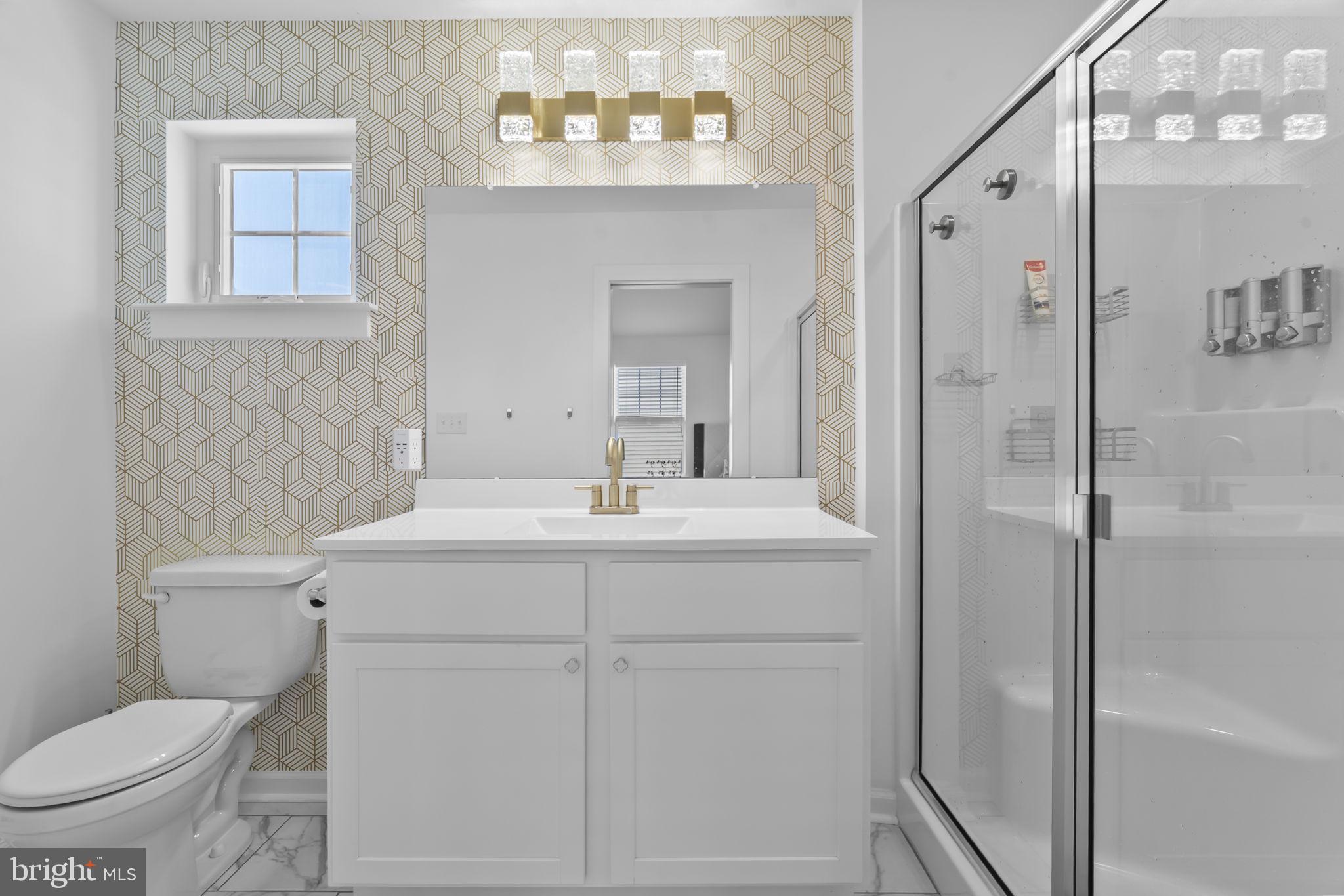 122 Church Road Jenkintown, PA 19046 - Photo 24 of 38 a bathroom with a toilet a sink and a mirror