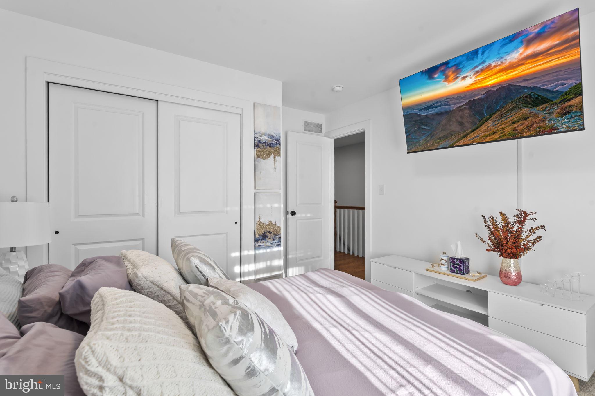 122 Church Road Jenkintown, PA 19046 - Photo 27 of 38 a bedroom with a bed and a painting on the wall