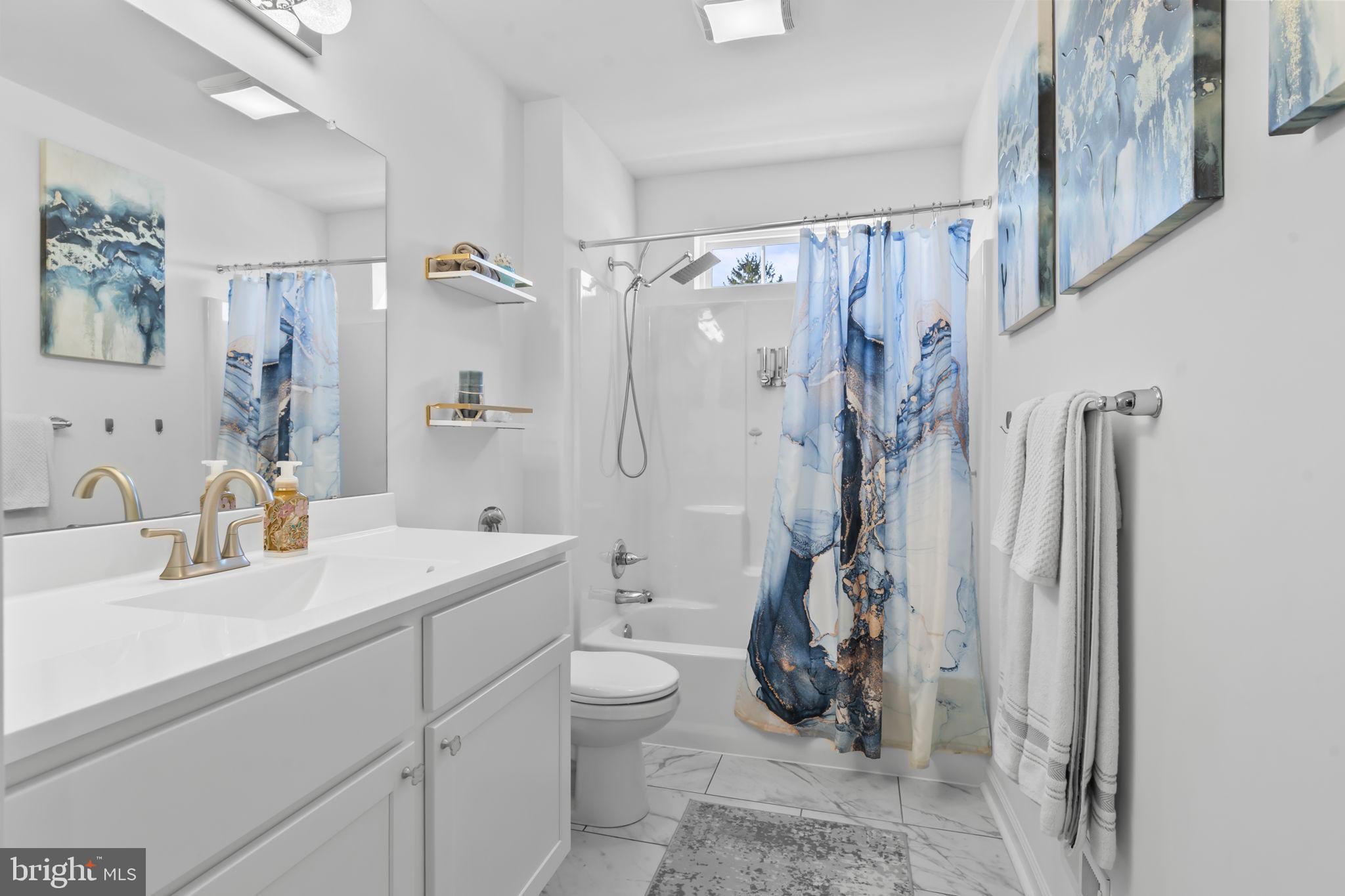 122 Church Road Jenkintown, PA 19046 - Photo 28 of 38 a bathroom with a sink a toilet and shower