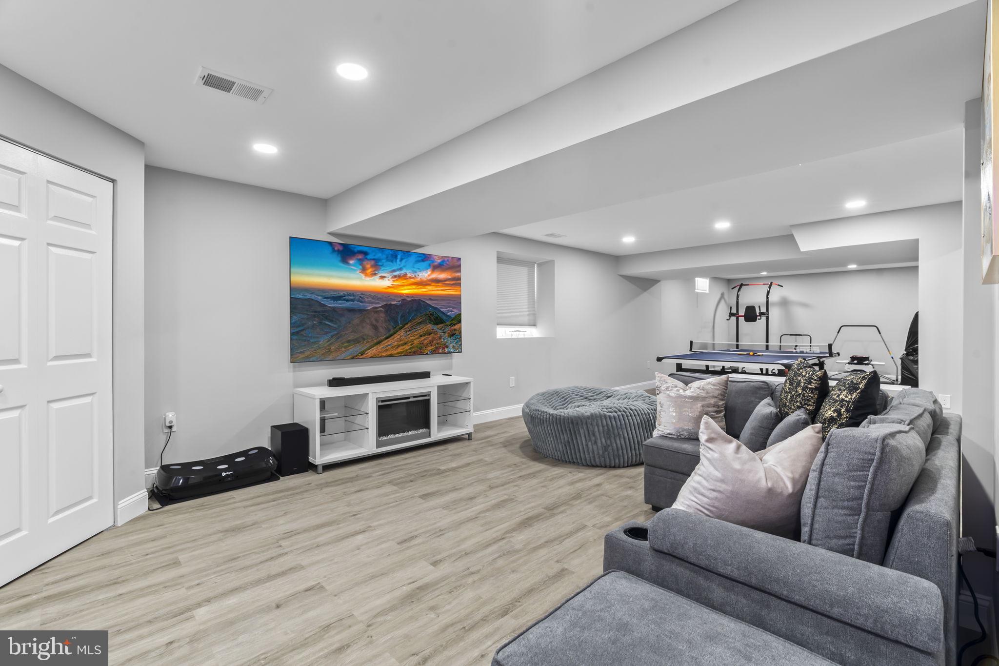 122 Church Road Jenkintown, PA 19046 - Photo 33 of 38 a living room with furniture and a flat screen tv