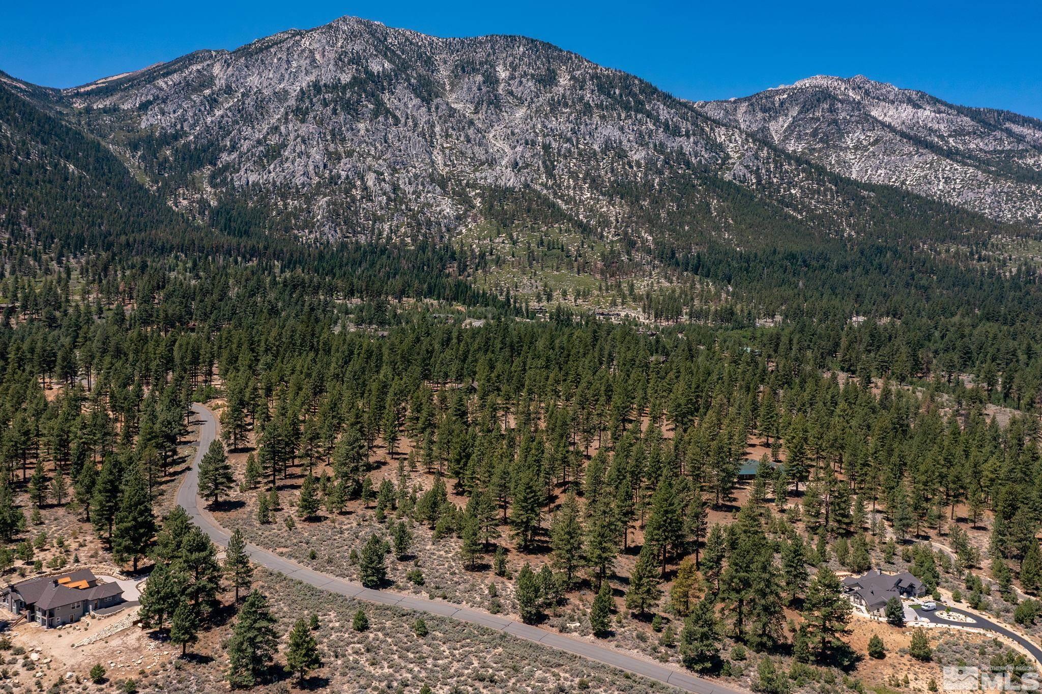 87 Five Creek Road Gardnerville, NV 89460 - Photo 9 of 21 a view of a large building with mountain view