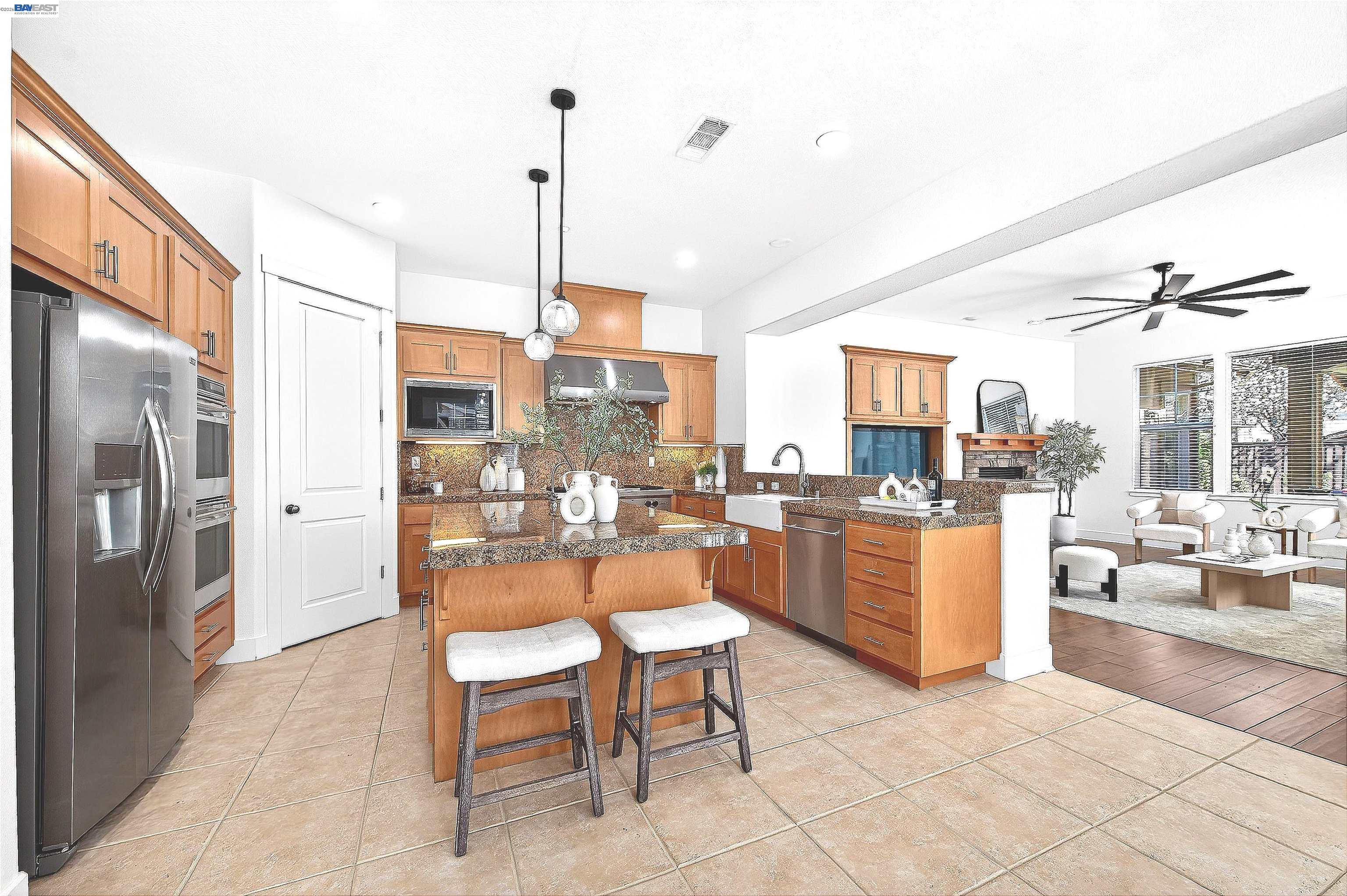 5564 Stockton Loop Livermore, CA 94550 - Photo 12 of 45 a dining room with stainless steel appliances kitchen island granite countertop a refrigerator a oven a sink with a dining table and chairs