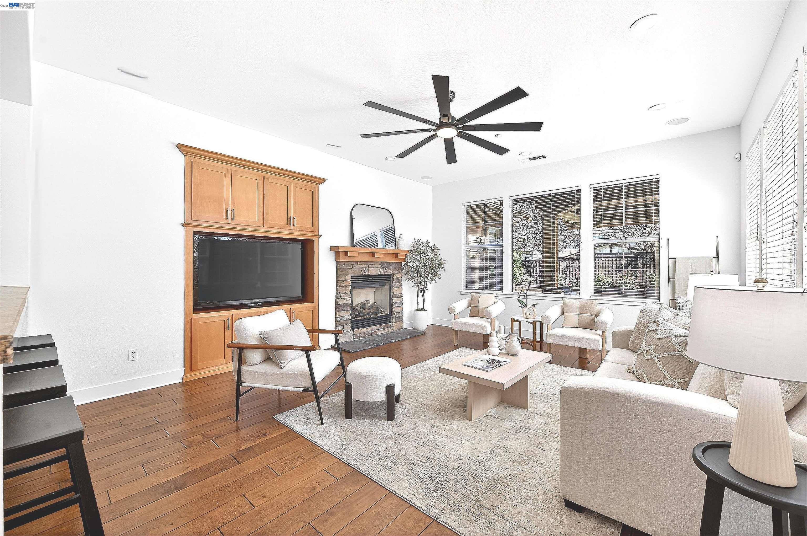 5564 Stockton Loop Livermore, CA 94550 - Photo 13 of 45 a living room with furniture a fireplace and a large window