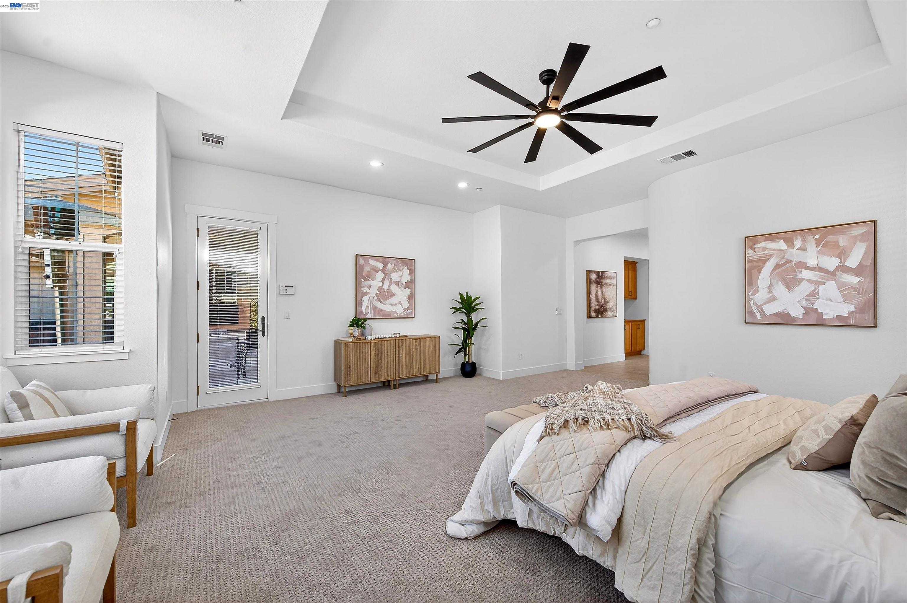 5564 Stockton Loop Livermore, CA 94550 - Photo 18 of 45 a bed room with a bed and a ceiling fan
