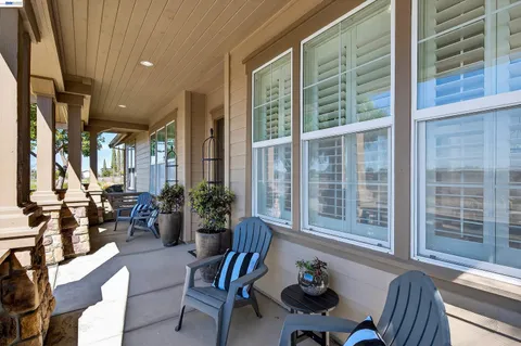 a living room with furniture and windows