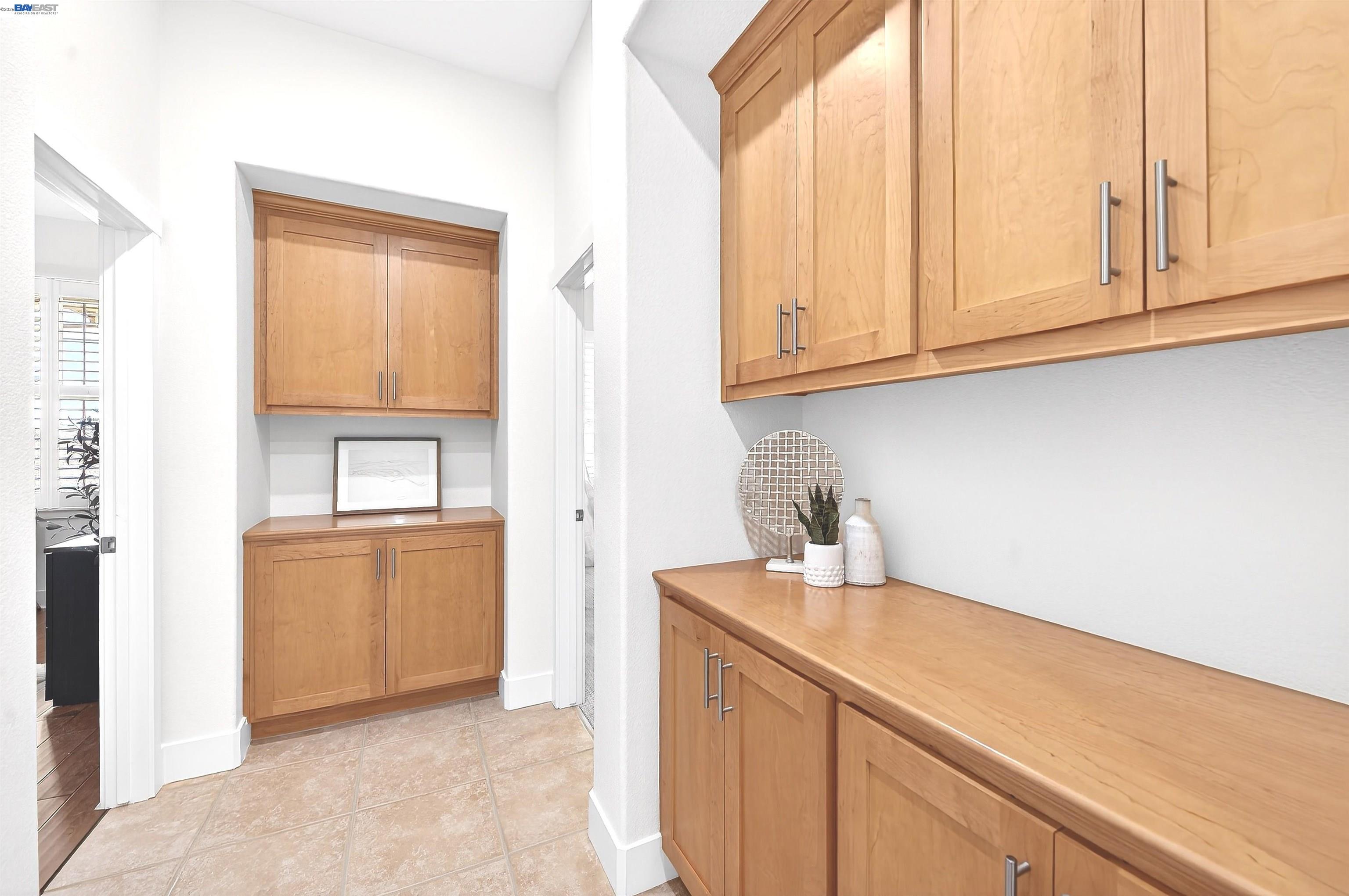 5564 Stockton Loop Livermore, CA 94550 - Photo 21 of 45 a kitchen with granite countertop white cabinets and a sink
