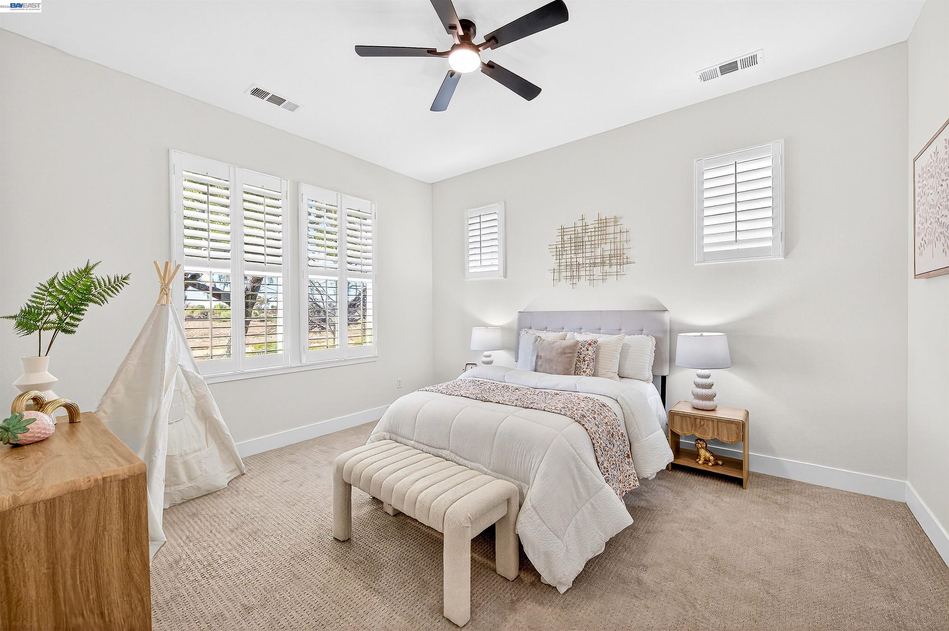 5564 Stockton Loop Livermore, CA 94550 - Photo 22 of 45 a bedroom with a bed and a window
