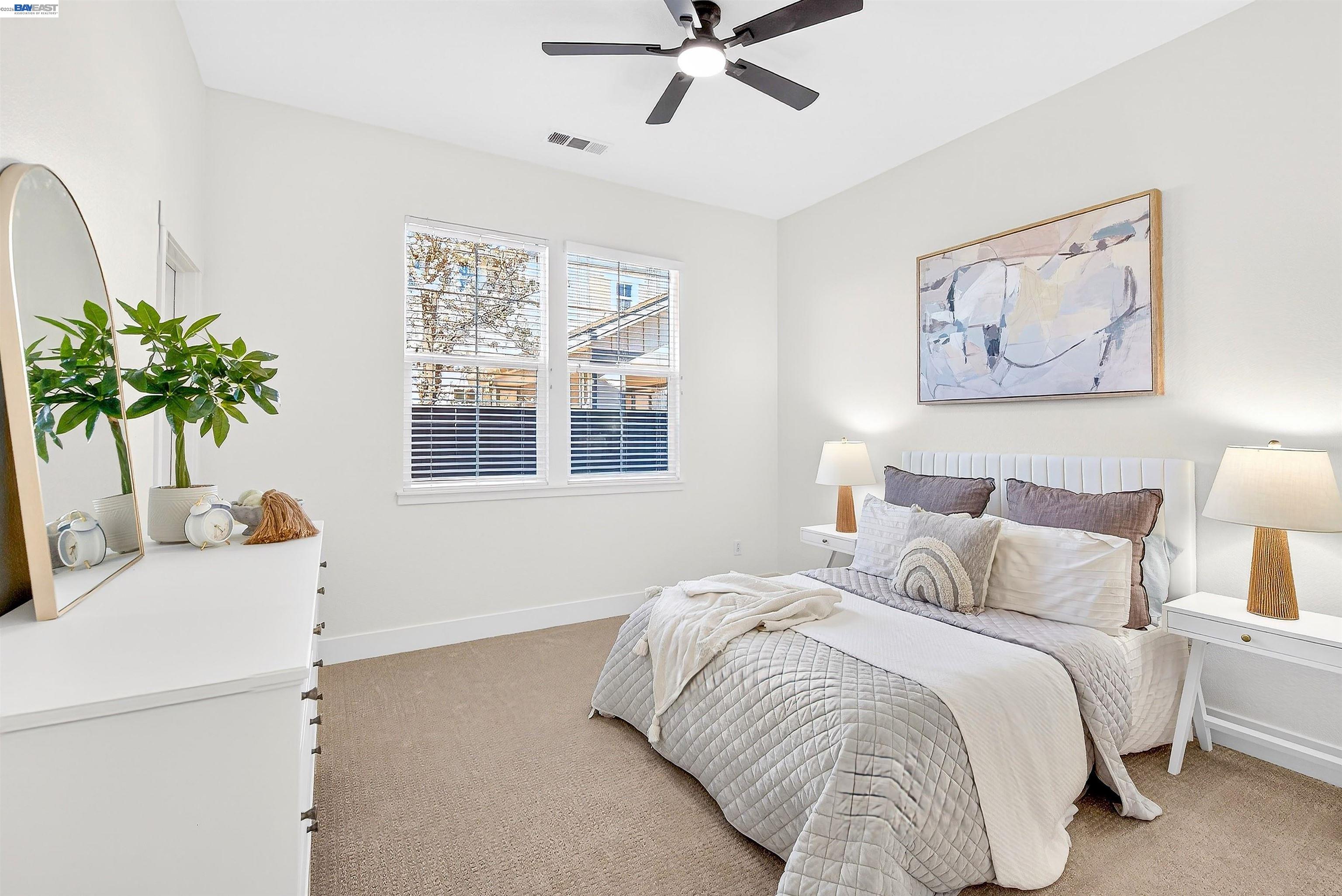 5564 Stockton Loop Livermore, CA 94550 - Photo 24 of 45 a bedroom with a bed and a potted plant