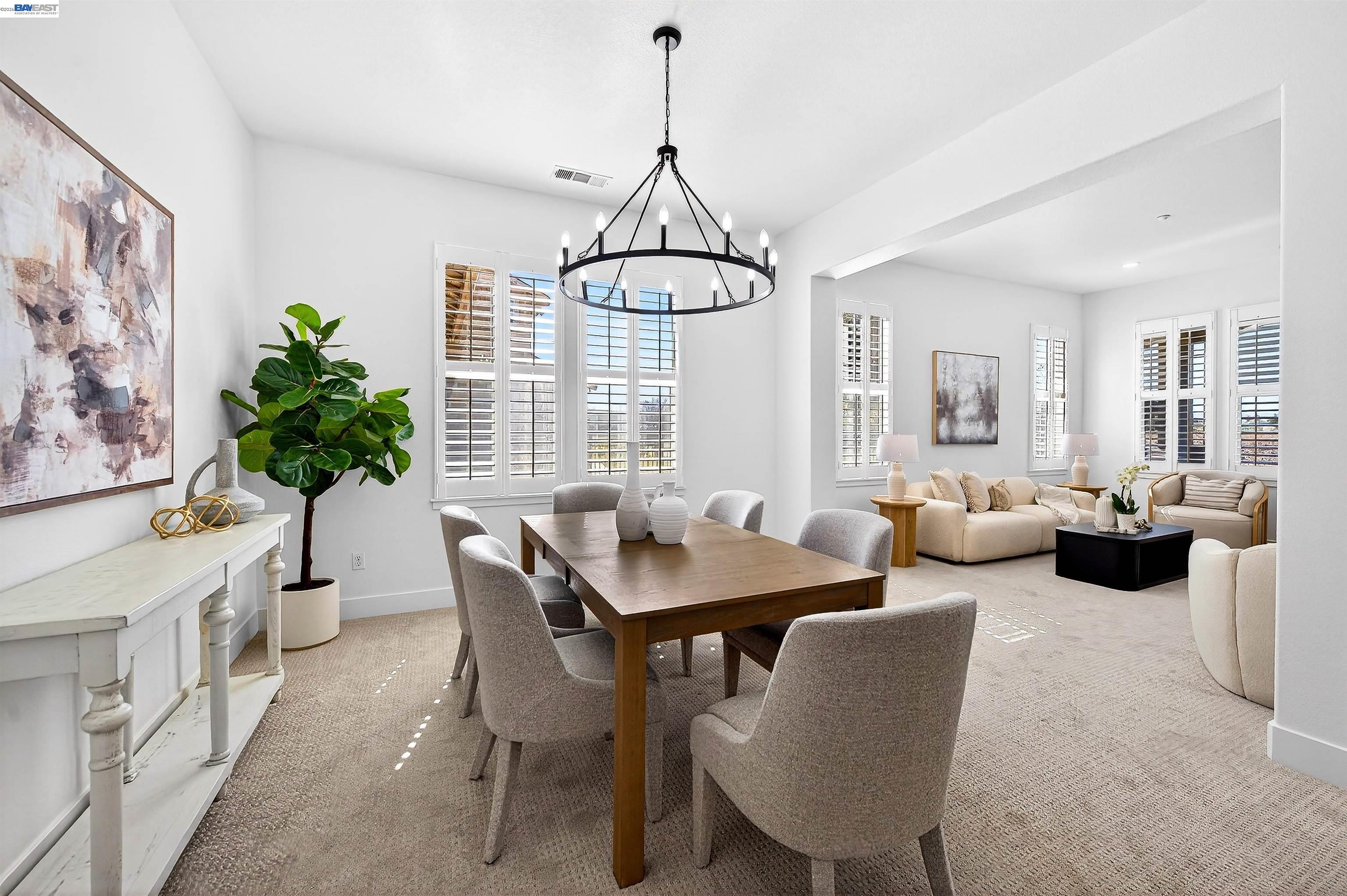 5564 Stockton Loop Livermore, CA 94550 - Photo 3 of 45 a view of a dining room with furniture window and wooden floor