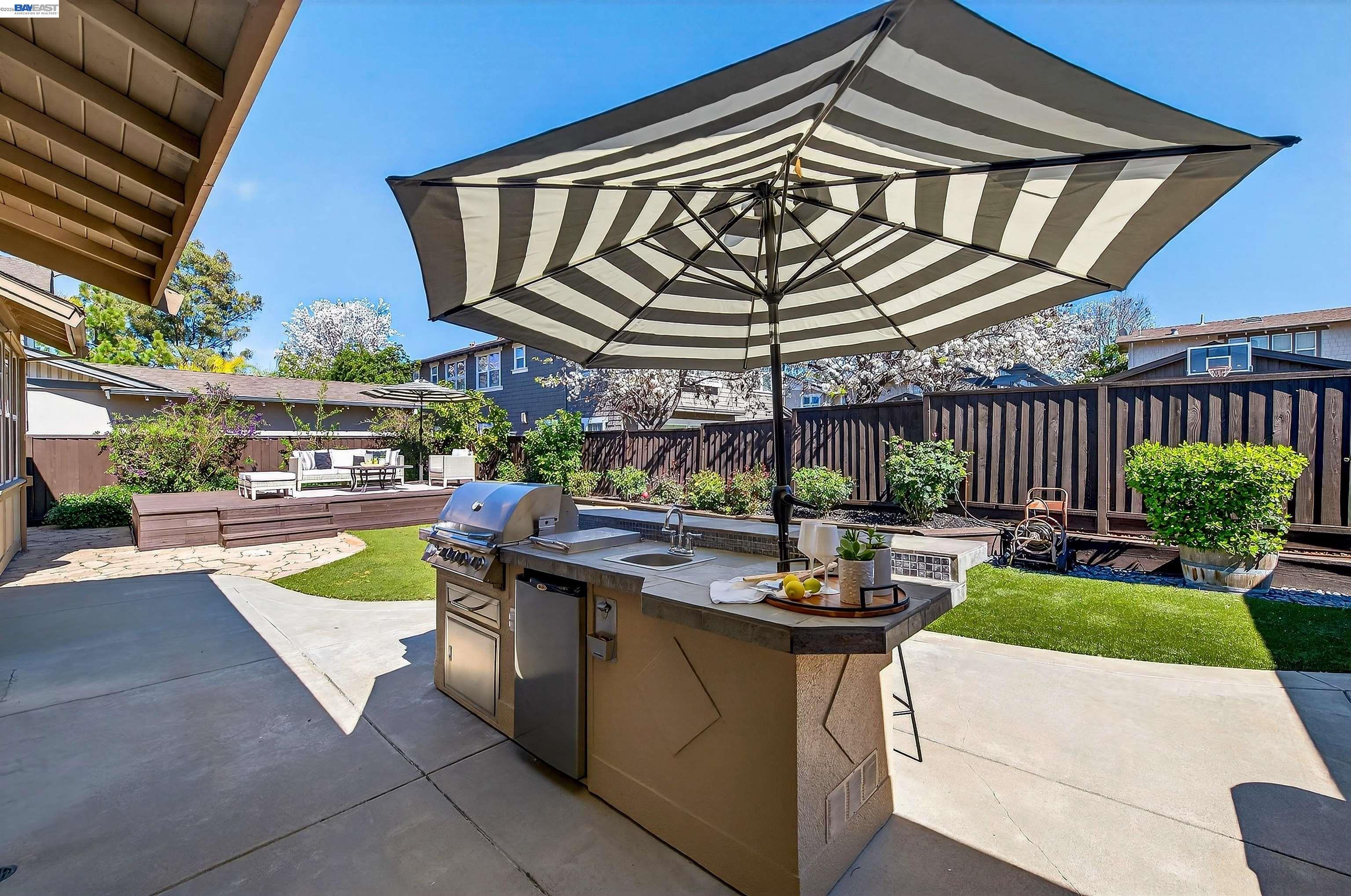 5564 Stockton Loop Livermore, CA 94550 - Photo 32 of 45 a view of a patio with a table and chairs