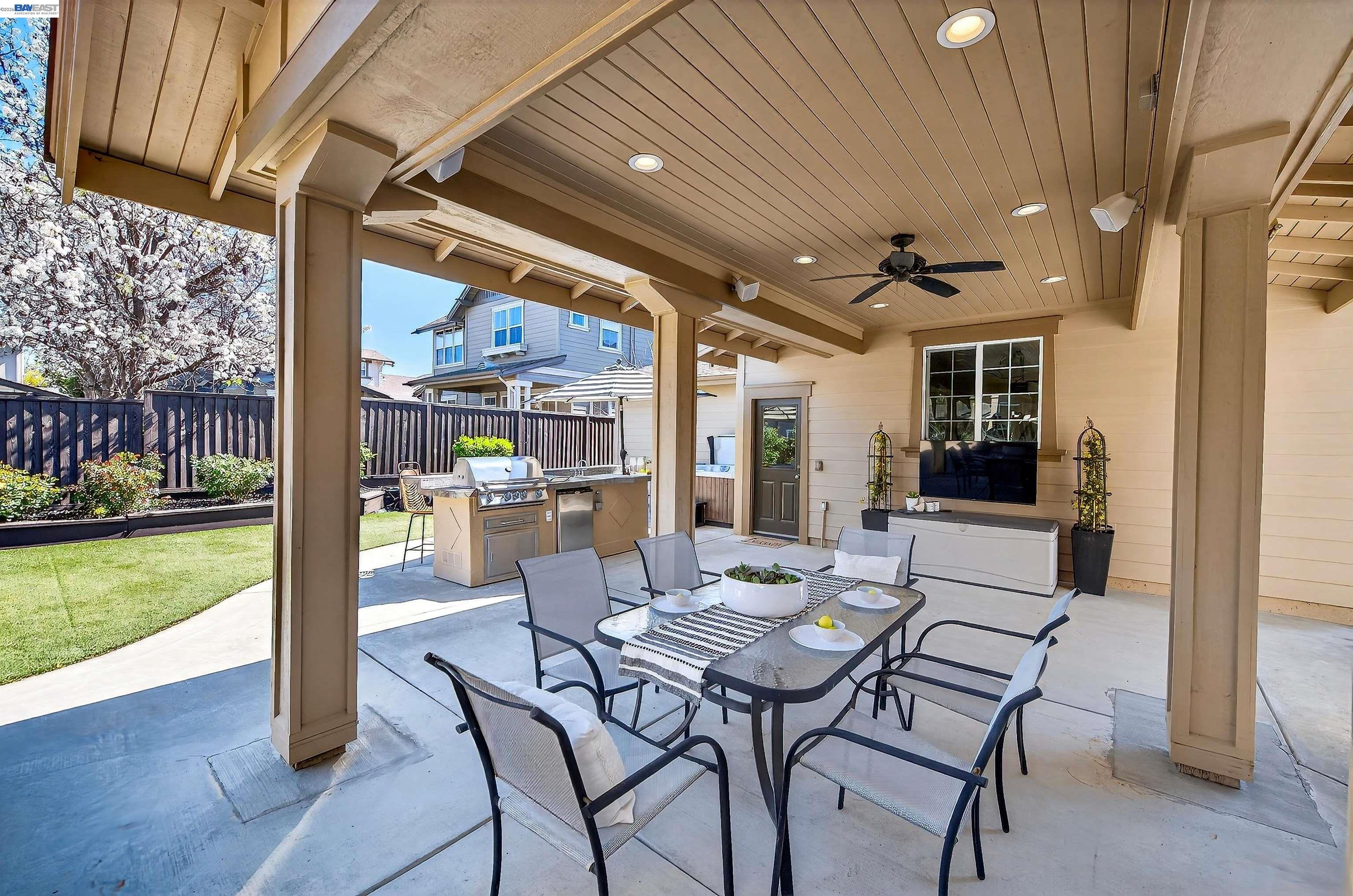5564 Stockton Loop Livermore, CA 94550 - Photo 33 of 45 a view of a patio with a table and chairs