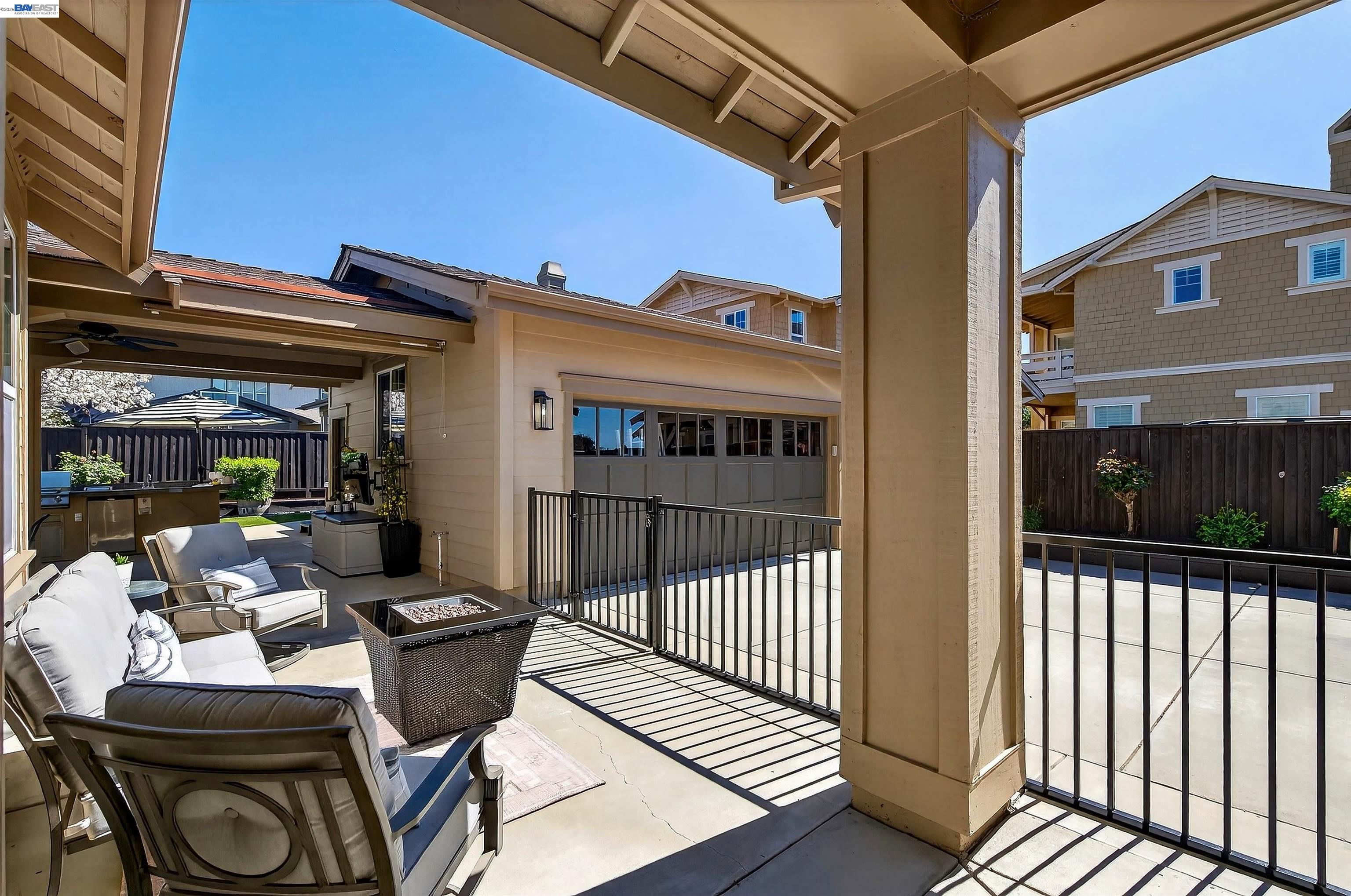 5564 Stockton Loop Livermore, CA 94550 - Photo 36 of 45 a view of a patio with dining table and chairs with wooden floor