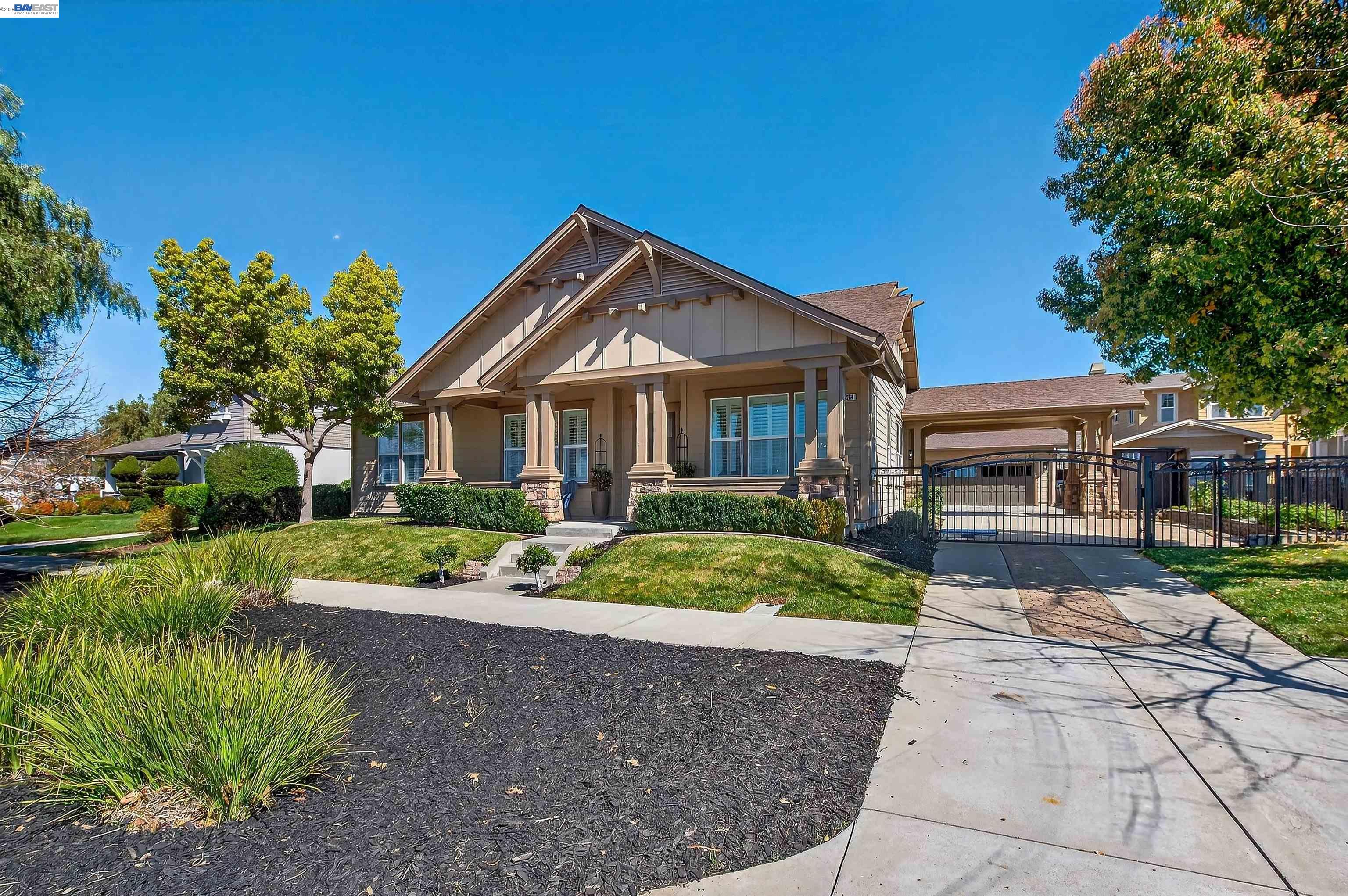 5564 Stockton Loop Livermore, CA 94550 - Photo 39 of 45 a front view of a house with a garden and trees