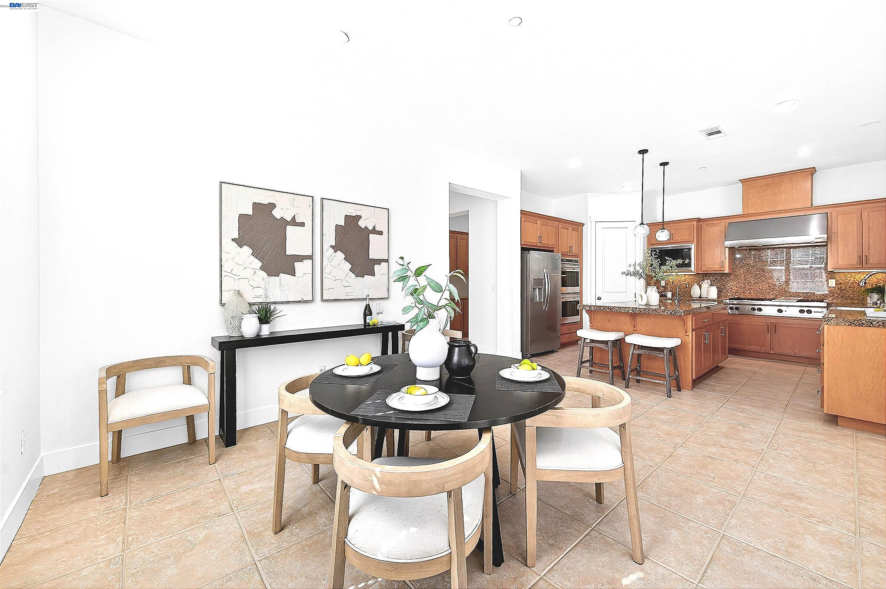 5564 Stockton Loop Livermore, CA 94550 - Photo 7 of 45 a dining room with furniture and a kitchen view