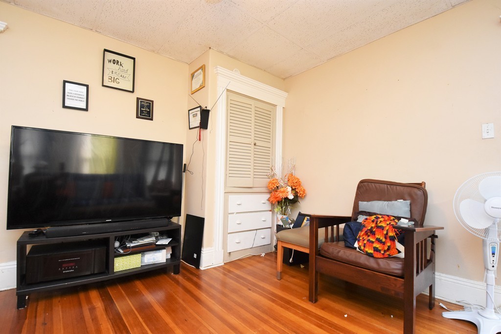 84 Vernal Street Everett, MA 02149 - Photo 13 of 26 a living room with furniture and a flat screen tv