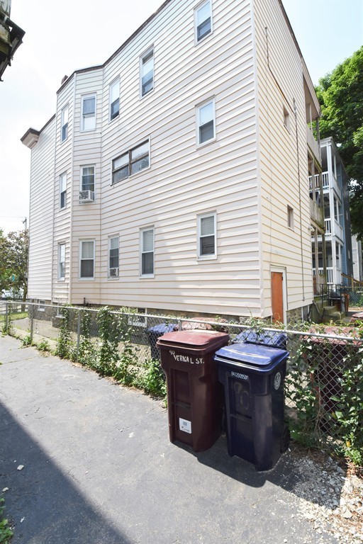 84 Vernal Street Everett, MA 02149 - Photo 17 of 26 a view of a house with backyard and sitting area