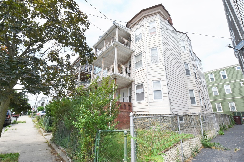 84 Vernal Street Everett, MA 02149 - Photo 2 of 26 a front view of a house with a yard