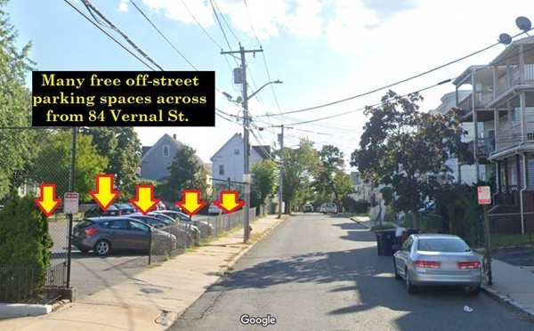 84 Vernal Street Everett, MA 02149 - Photo 23 of 26 a view of a street with cars parked on the roadside