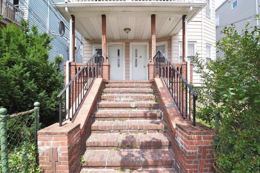 84 Vernal Street Everett, MA 02149 - Photo 4 of 26 a view of a building with entryway and stairs