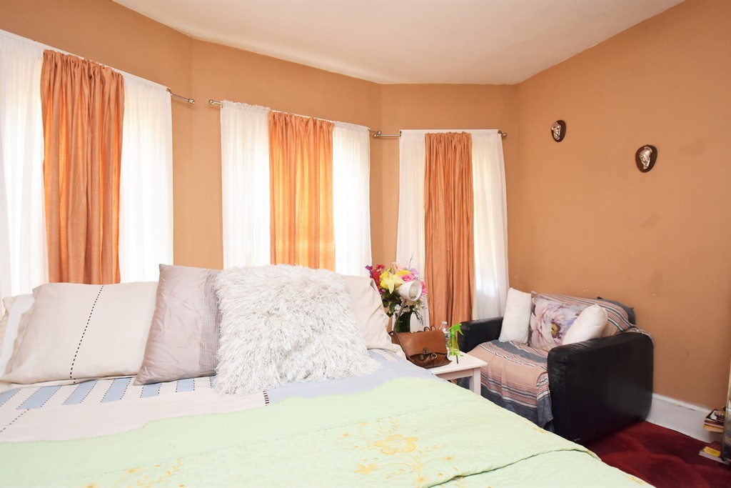 84 Vernal Street Everett, MA 02149 - Photo 7 of 26 a bedroom with a bed and a couch